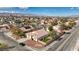 A high angle shot of a home with a two car garage and green artificial turf in the backyard at 344 E Rush Ave, Las Vegas, NV 89183
