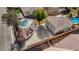 Aerial view of the backyard featuring a sparkling pool, lounge chairs, and a detached two-car garage at 344 E Rush Ave, Las Vegas, NV 89183