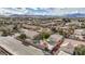 Aerial view of a home with a pool and a detached two car garage in a desert community at 344 E Rush Ave, Las Vegas, NV 89183