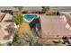 Backyard aerial view featuring a pool, a grass lawn, patio, and beautiful tile roof at 344 E Rush Ave, Las Vegas, NV 89183