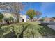 Green backyard featuring stone trim and lush landscaping at 344 E Rush Ave, Las Vegas, NV 89183