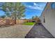 Brick-paved backyard with an easy to maintain lawn is great for entertaining or relaxing at 344 E Rush Ave, Las Vegas, NV 89183