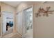 Hallway view of neutral-colored bathroom with sliding door shower/tub at 344 E Rush Ave, Las Vegas, NV 89183