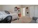 Bedroom featuring a comfortable bed, workspace, and ample closet space at 344 E Rush Ave, Las Vegas, NV 89183