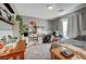 Well-lit bedroom with workspace, decorative shelves, and ample storage at 344 E Rush Ave, Las Vegas, NV 89183