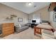 Bright bedroom with vaulted ceiling, cozy sitting area, and natural light at 344 E Rush Ave, Las Vegas, NV 89183