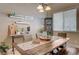 Charming dining area features a rustic table with bench seating and a decorative light fixture at 344 E Rush Ave, Las Vegas, NV 89183