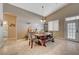 Inviting dining area with vaulted ceilings, rustic wood table, and access to the outdoors at 344 E Rush Ave, Las Vegas, NV 89183