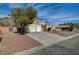 Single-story home with three-car garage and low-maintenance landscaping for a clean, desert aesthetic at 344 E Rush Ave, Las Vegas, NV 89183