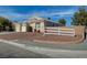 Single-story home with a three-car garage, complemented by tasteful desert landscaping for low maintenance at 344 E Rush Ave, Las Vegas, NV 89183