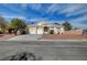Charming single-story home with a well-maintained lawn and a spacious three-car garage at 344 E Rush Ave, Las Vegas, NV 89183
