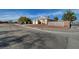 Single-story home features desert landscaping, three-car garage, and a cozy suburban feel at 344 E Rush Ave, Las Vegas, NV 89183