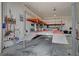 Spacious garage featuring a car lift and ample room for storage, perfect for car enthusiasts and DIY projects at 344 E Rush Ave, Las Vegas, NV 89183