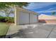 Spacious detached garage with two bays and ample parking space, offering secure storage and potential workshop area at 344 E Rush Ave, Las Vegas, NV 89183