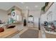 Sunlit kitchen featuring stainless appliances, granite countertops, and ample cabinet space, flowing into a large living area at 344 E Rush Ave, Las Vegas, NV 89183