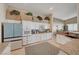 Bright, updated kitchen with granite countertops, stainless appliances, and white cabinets, offering modern convenience at 344 E Rush Ave, Las Vegas, NV 89183