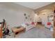 Spacious living room featuring neutral walls, carpet, and a comfortable white sofa at 344 E Rush Ave, Las Vegas, NV 89183