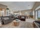 Expansive living space featuring an open kitchen, dining, and living room with tile flooring at 344 E Rush Ave, Las Vegas, NV 89183