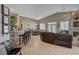 Open-concept living space includes a kitchen, dining, and living area with tile flooring at 344 E Rush Ave, Las Vegas, NV 89183
