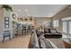 Spacious living space featuring an open kitchen, dining, and living room with tile flooring at 344 E Rush Ave, Las Vegas, NV 89183