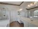 Bright bathroom featuring a shower, double sinks, and soaking tub at 344 E Rush Ave, Las Vegas, NV 89183