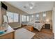 Bright main bedroom with hardwood floors, sitting area, and multiple windows at 344 E Rush Ave, Las Vegas, NV 89183