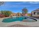 Beautiful pool area with blue water, trees, and elegant brick trim at 344 E Rush Ave, Las Vegas, NV 89183