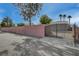 Wrought iron gate in front of walled perimeter ensures privacy and security at 344 E Rush Ave, Las Vegas, NV 89183