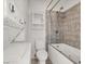 Bathroom with a jacuzzi tub and shower combo, featuring built-in shelves, and neutral tile at 3682 Melonies Dr # 5, Las Vegas, NV 89103