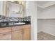 Bathroom features modern vanity, decorative backsplash and walk-in closet at 3682 Melonies Dr # 5, Las Vegas, NV 89103