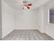 A bright and airy bedroom showcasing neutral paint and tile flooring at 3682 Melonies Dr # 5, Las Vegas, NV 89103