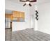 Open-concept living room features neutral tile flooring, ceiling fan, and combined kitchen at 3682 Melonies Dr # 5, Las Vegas, NV 89103