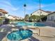 Community pool and spa surrounded by lush landscaping and palm trees on a sunny day at 3682 Melonies Dr # 5, Las Vegas, NV 89103
