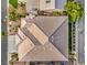 Aerial top-down view of a home's tile roof with landscaping and neighborhood greenery visible around at 4664 Stuttgart St, Las Vegas, NV 89147