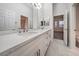 Bathroom featuring a double sink vanity with a marble countertop at 4664 Stuttgart St, Las Vegas, NV 89147