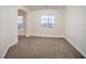 Bright bedroom with neutral carpet, and a large window offering views at 4664 Stuttgart St, Las Vegas, NV 89147