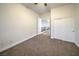 This bedroom features plush carpeting, a ceiling fan, and a closet at 4664 Stuttgart St, Las Vegas, NV 89147