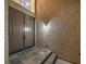 The entryway to the house features a stone tile stepway, and a set of double doors at 4664 Stuttgart St, Las Vegas, NV 89147