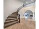 Grand entryway features a curved staircase, wood floors, and an open floor plan at 4664 Stuttgart St, Las Vegas, NV 89147