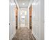 Hallway with closet space leading to an elegant bathroom with a soaking tub at 4664 Stuttgart St, Las Vegas, NV 89147