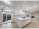 Stylish kitchen showcasing a center island, modern fixtures, and access to the backyard at 4664 Stuttgart St, Las Vegas, NV 89147
