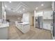 Modern kitchen with a large island, stainless steel appliances, and ample cabinet space at 4664 Stuttgart St, Las Vegas, NV 89147
