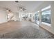 Bright open floor plan with luxury vinyl floors and a large decorative rug in living room at 4664 Stuttgart St, Las Vegas, NV 89147