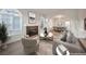 A brightly lit living room is shown with stylish furniture, fireplace, and an open floor plan at 4664 Stuttgart St, Las Vegas, NV 89147