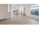 Open-concept living area with a view of the kitchen, perfect for entertaining guests at 4664 Stuttgart St, Las Vegas, NV 89147