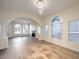 Expansive living room area with open floor plan, fireplace, and smooth hardwood floors at 4664 Stuttgart St, Las Vegas, NV 89147