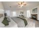 Spacious main bedroom featuring a fireplace, neutral color scheme, and access to additional rooms at 4664 Stuttgart St, Las Vegas, NV 89147