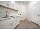 A mud room with modern cabinetry and hardware, wood-look flooring, and ample space at 4664 Stuttgart St, Las Vegas, NV 89147