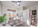 Home office featuring a modern desk, closet, and shelving for storage and display at 56 Tatahatso Point St, Henderson, NV 89011