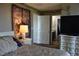 Cozy bedroom with neutral decor, a comfortable bed, and ample natural light at 5705 Petrified Tree Ln, North Las Vegas, NV 89081